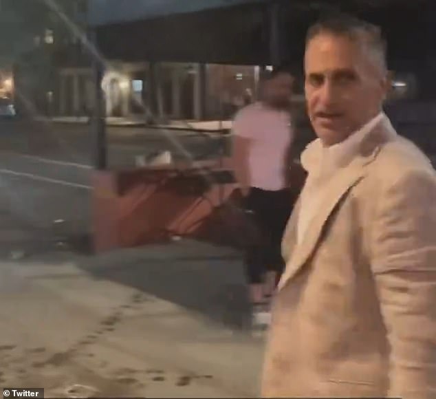 The banker, seen here turning triumphantly in the wake of the attack, works as a Managing Director at Moelis & Company, a leading investment bank with offices in Midtown Manhattan