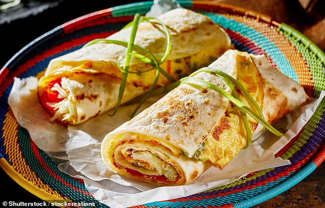 'My favourite food is the Rolex (pictured). It’s an omelette wrapped in a chapatti and made fresh in front of you on an iron griddle at tiny roadside stalls,' says Alice (stock image)