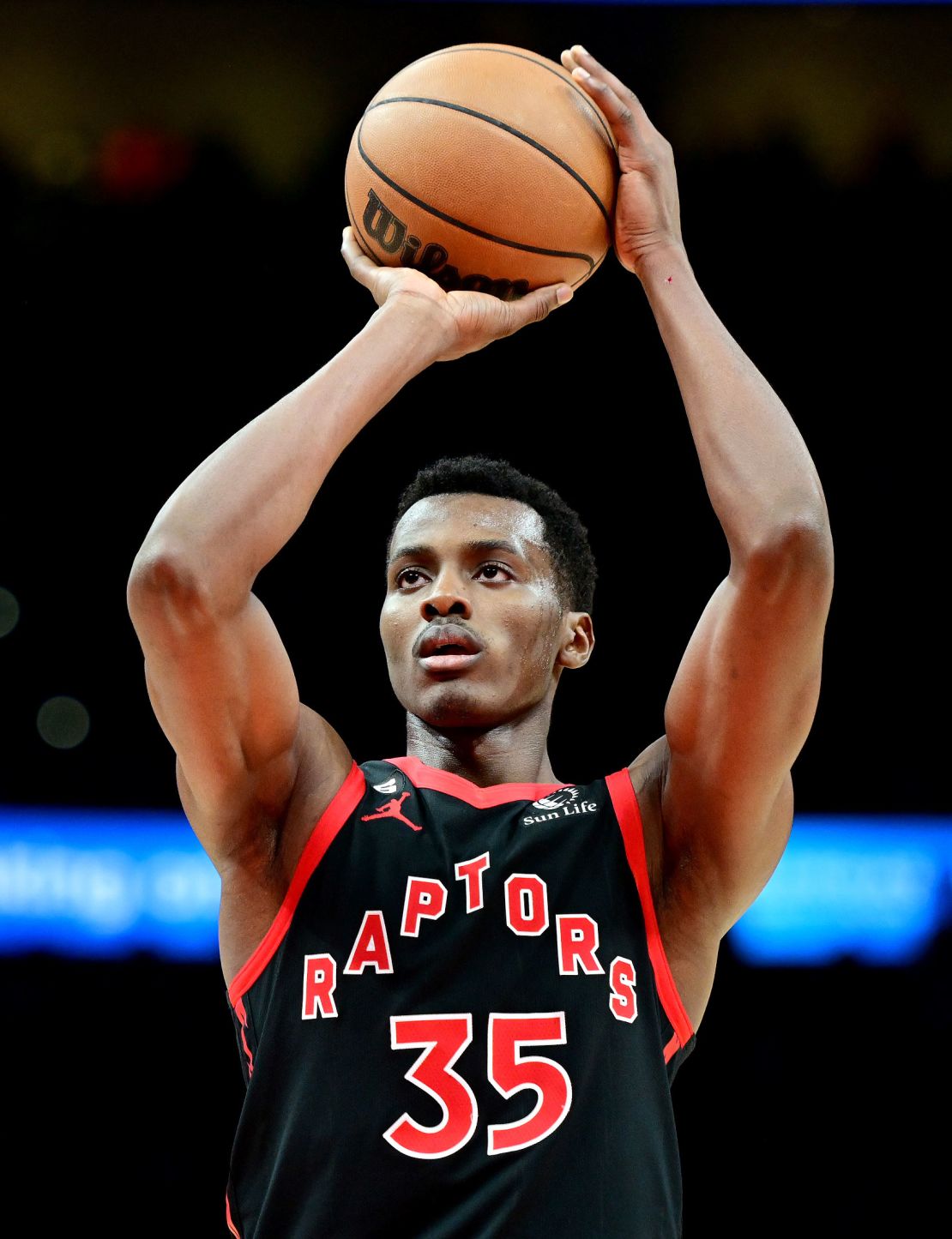 Christian Koloko of the Toronto Raptors shoots a free throw against the Atlanta Hawks on November 19, 2022, at State Farm Arena in Atlanta.